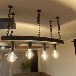 Adesigner lighting above adining table as part of a designed bespoke lighting