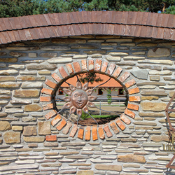 A wrought iron grille - a hammered sun