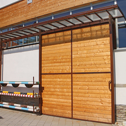 A sliding metal door combined with wood