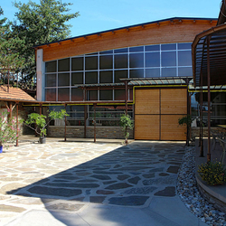A shelter and a sliding door - an entrance to a riding hall A shelter and a sliding door - an entrance to a riding hall