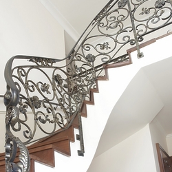 Interior staircase railing in afamily home  forged railing