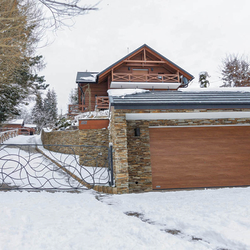 An exclusive hand-forged gate for a cottage under the forest