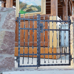 A hand-wrought iron gate pattern - Crazy - in the entrance of the area