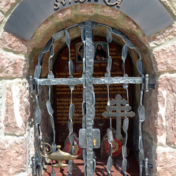 Forged monument of Saints with characteristic features: Jar with fire, Lebanese Cross