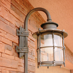 A wrought iron garden lamp with glass A wrought iron garden lamp with glass