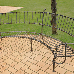 A wrought iron garden bench