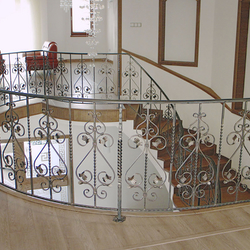 A curved wrought iron railing