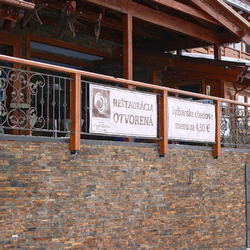 Exclusive exterior railings and a massive wrought iron door - the entrance and terrace of the Hotel Galileo