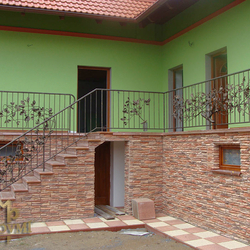 A wrought iron railing - an oak branch motif