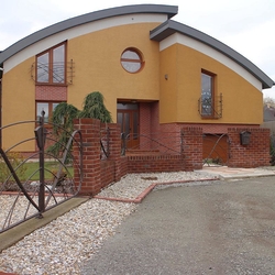 A wrought iron fence - A modern gate and fence