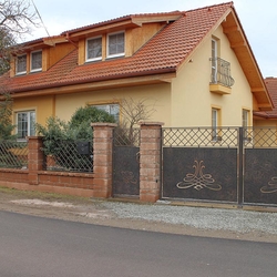 A wrought iron fence - A full gate