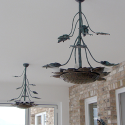 A wrought iron sunflower as a chandelier