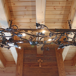 A wrought iron chandelier on a ladder - vine