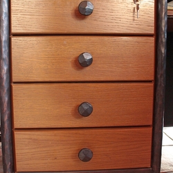 Quality forged handles on drawers of an office desk  wrought-iron furniture