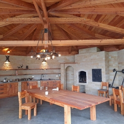 Lamps in the gazebo with a forest motif - hanging chandelier Oak and wall lamps Bark of tree