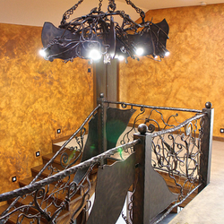 Hand wrought iron interior staircase railing - Roots