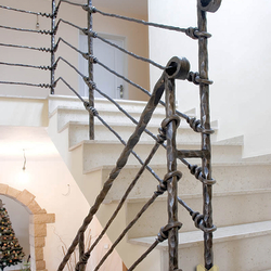 A wrought iron stair railing - Knot pattern